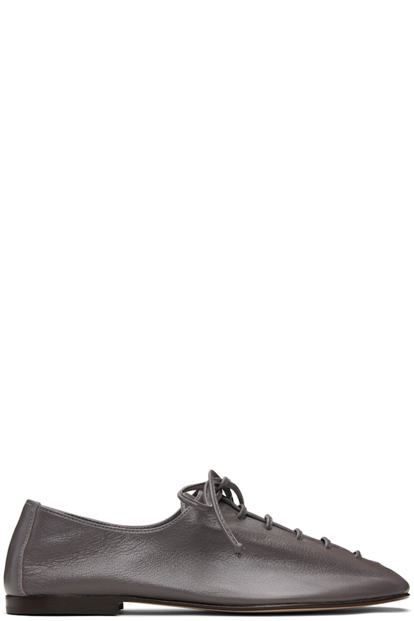 Handcrafted grained lambskin derbys.

· Square toe
· Lace-up closure
· Suede interior
· Stacked calfskin heel
· Calfskin nubuck sole

Supplier color: Grey