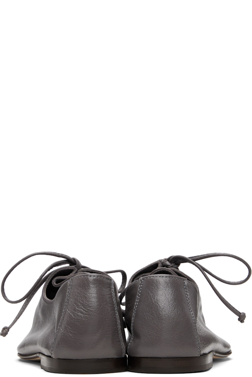 Handcrafted grained lambskin derbys.

· Square toe
· Lace-up closure
· Suede interior
· Stacked calfskin heel
· Calfskin nubuck sole

Supplier color: Grey