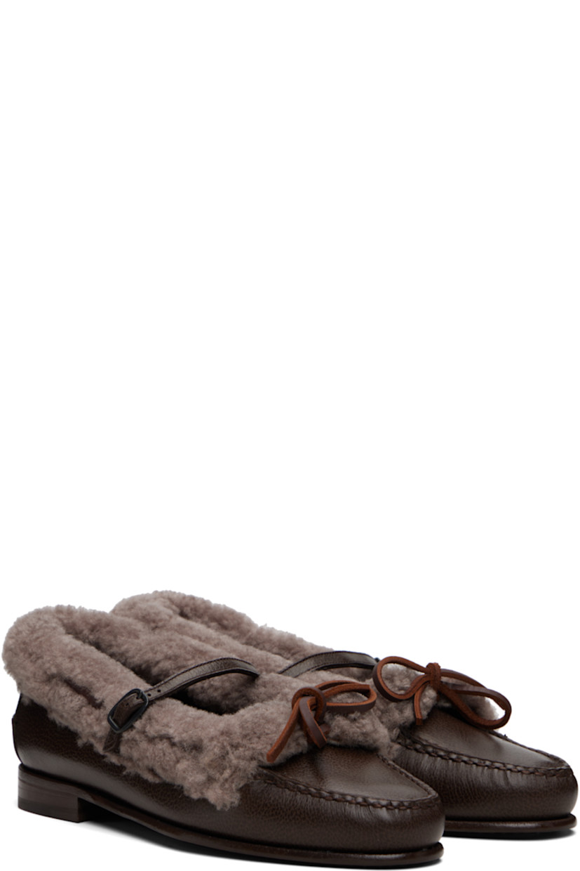 Grained calfskin and shearling loafers.

· Moc toe 
· Bow and pin-buckle strap at vamp
· Pinched seam at heel counter
· Calfskin sole with rubber injection

Supplier color: Dark brown