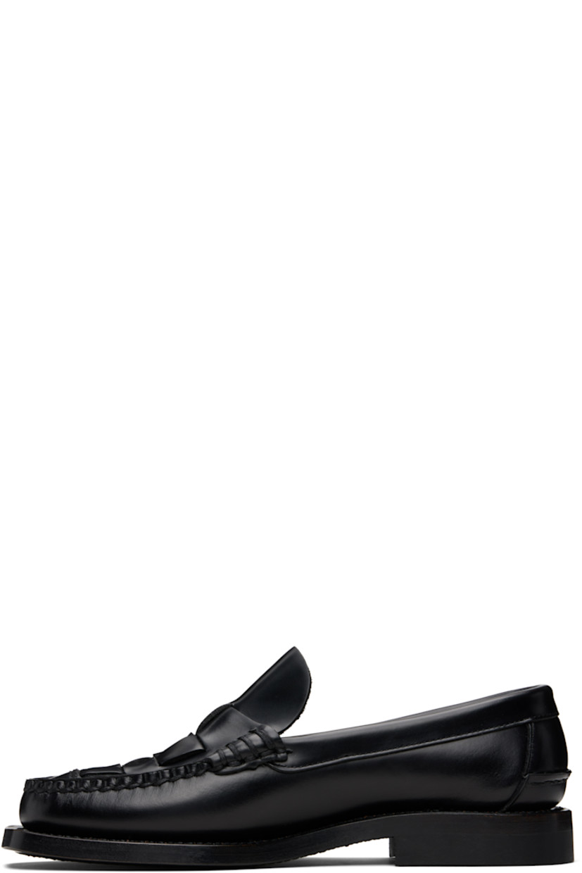 Handcrafted buffed calfskin loafers.

· Moc toe
· Woven detailing at vamp
· Pinched seam at heel counter
· Suede interior
· Stacked calfskin heel
· Calfskin sole

Supplier color: Black