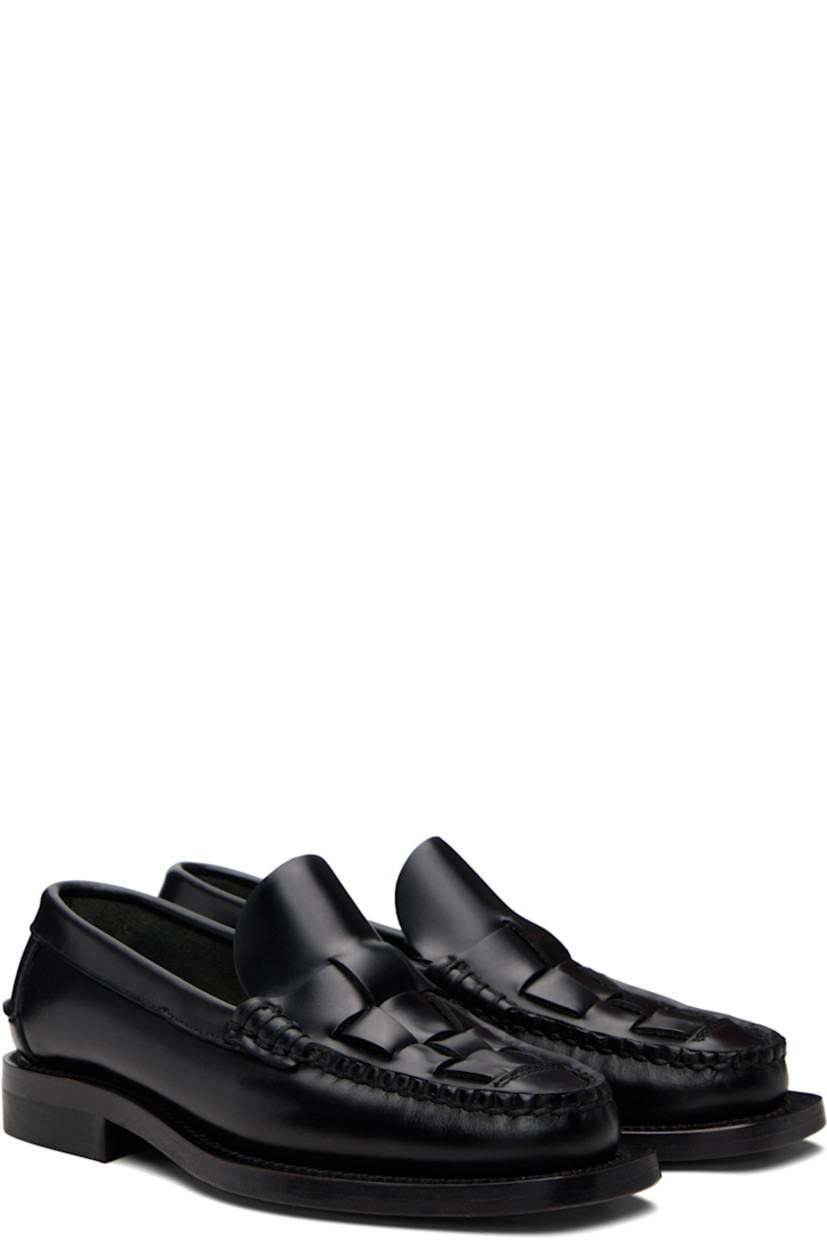 Handcrafted buffed calfskin loafers.

· Moc toe
· Woven detailing at vamp
· Pinched seam at heel counter
· Suede interior
· Stacked calfskin heel
· Calfskin sole

Supplier color: Black