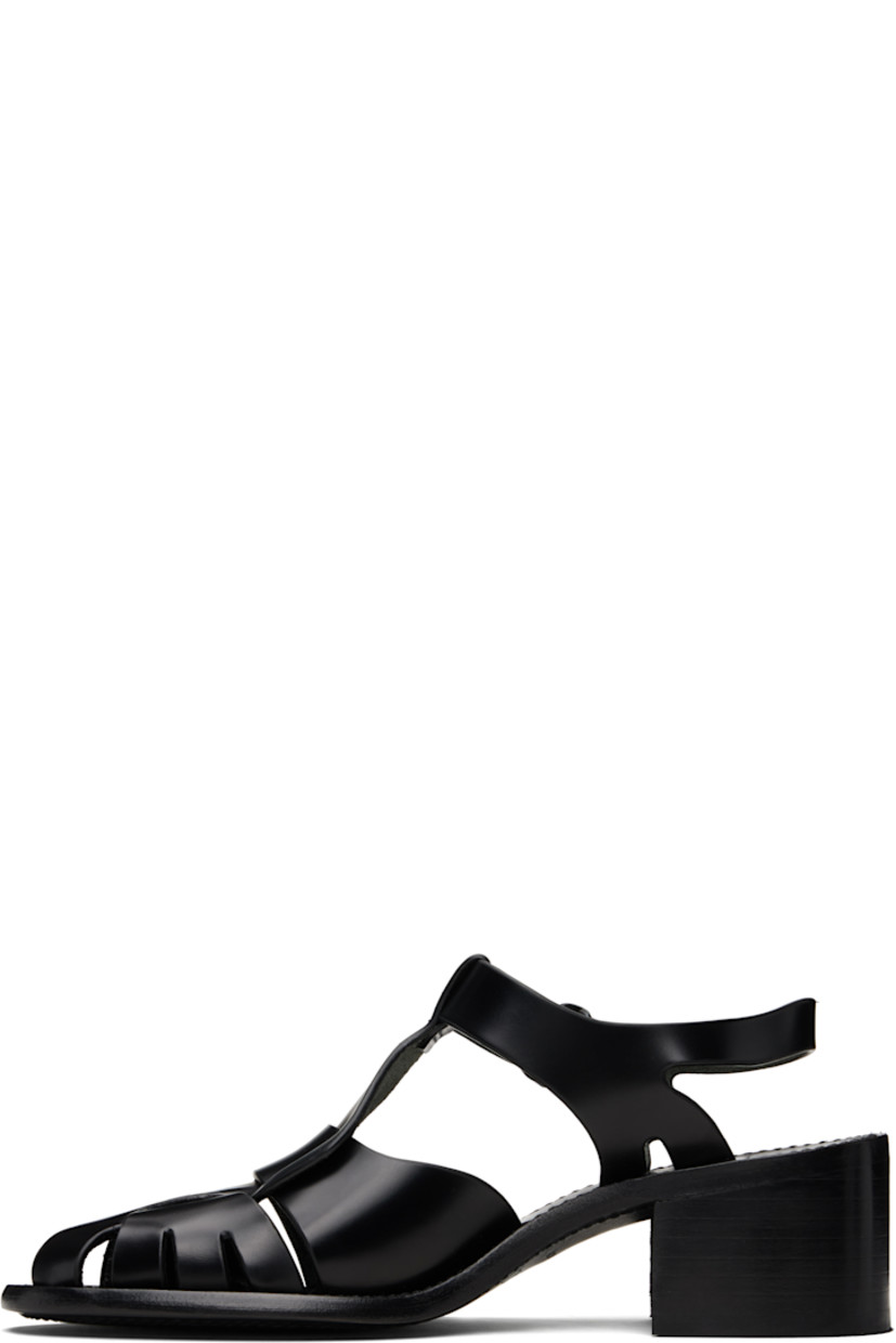 Handcrafted buffed calfskin heeled sandals.

· Cutouts throughout
· Woven detailing at vamp
· Pin-buckle ankle strap
· Logo embossed at footbed
· Stacked calfskin block heel
· Calfskin sole
· Heel: H2"

Supplier color: Black
