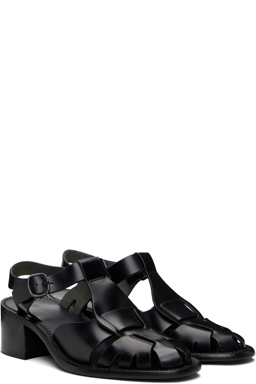 Handcrafted buffed calfskin heeled sandals.

· Cutouts throughout
· Woven detailing at vamp
· Pin-buckle ankle strap
· Logo embossed at footbed
· Stacked calfskin block heel
· Calfskin sole
· Heel: H2"

Supplier color: Black
