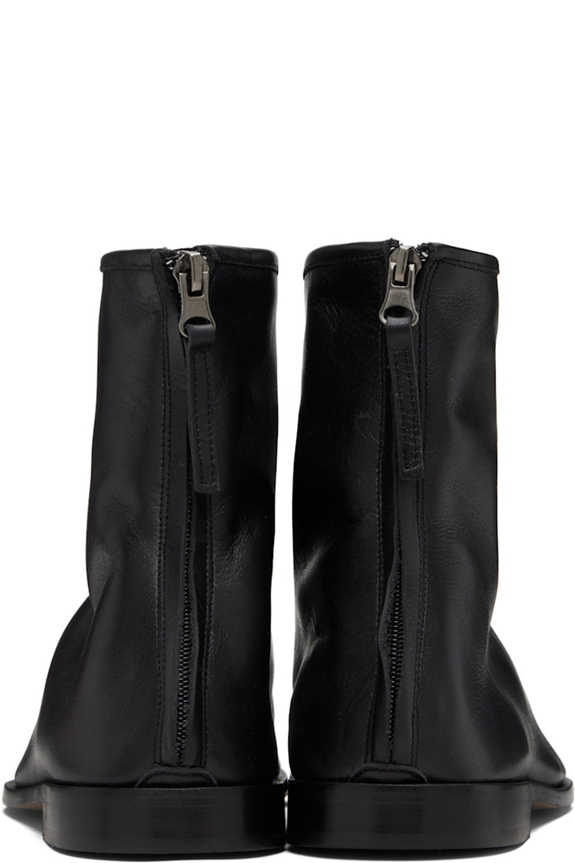 Ankle-high grained calfskin boots.

· Moc toe
· Zip closure at heel
· Calfskin suede lining
· Stacked leather heel with rubber injection
· Calfskin sole

Supplier color: Black