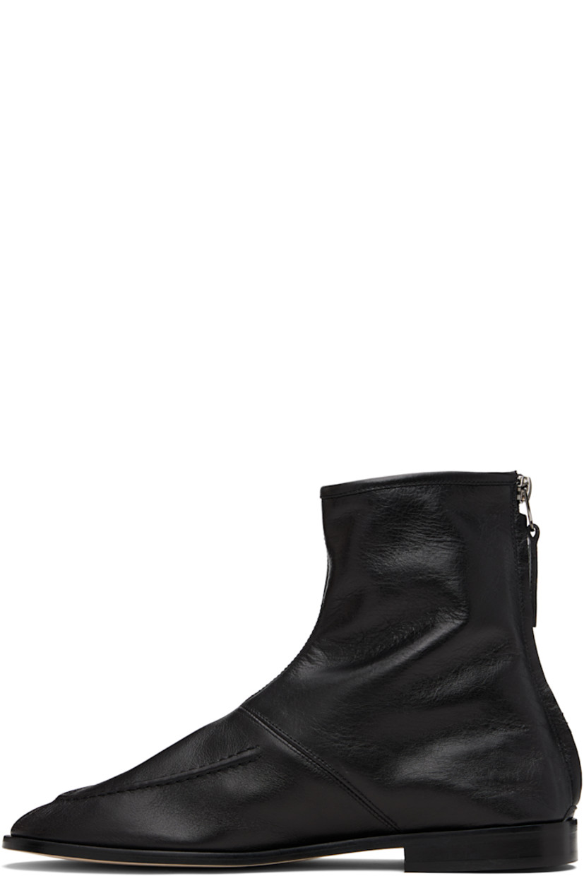 Ankle-high grained calfskin boots.

· Moc toe
· Zip closure at heel
· Calfskin suede lining
· Stacked leather heel with rubber injection
· Calfskin sole

Supplier color: Black