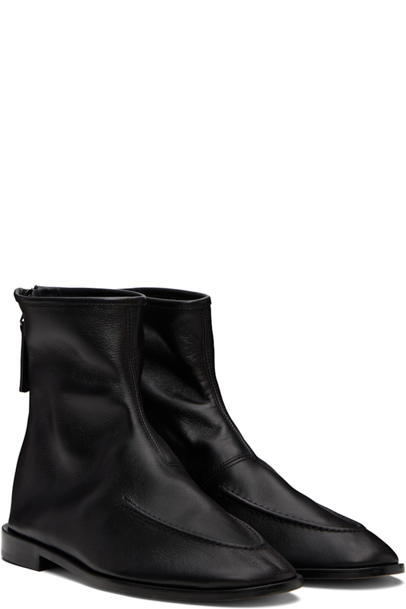 Ankle-high grained calfskin boots.

· Moc toe
· Zip closure at heel
· Calfskin suede lining
· Stacked leather heel with rubber injection
· Calfskin sole

Supplier color: Black