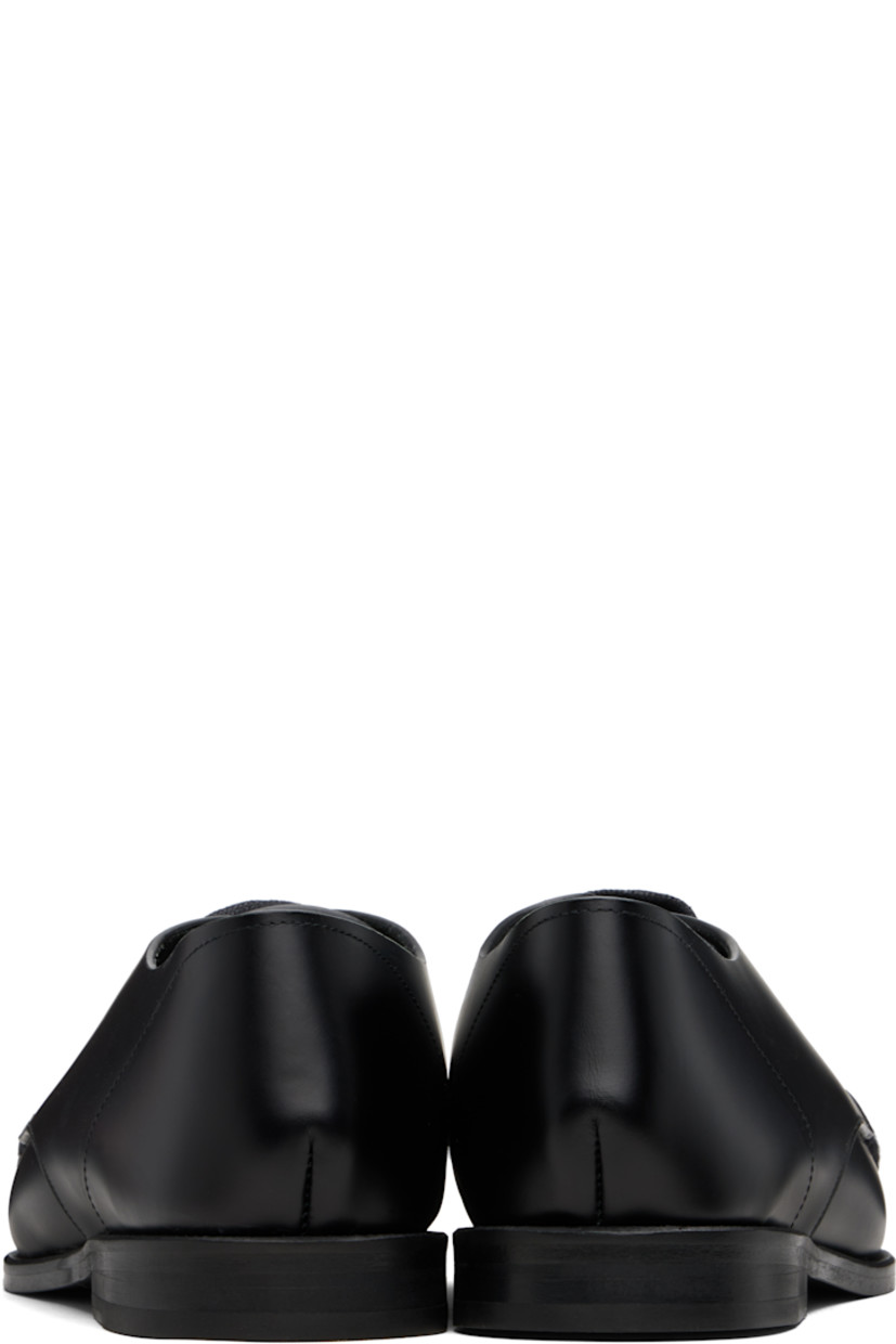 Polished calfskin derbys.

· Braided detailing at square moc toe
· Lace-up closure
· Suede lining
· Stacked leather heel with rubber injection
· Calfskin sole

Supplier color: Black
