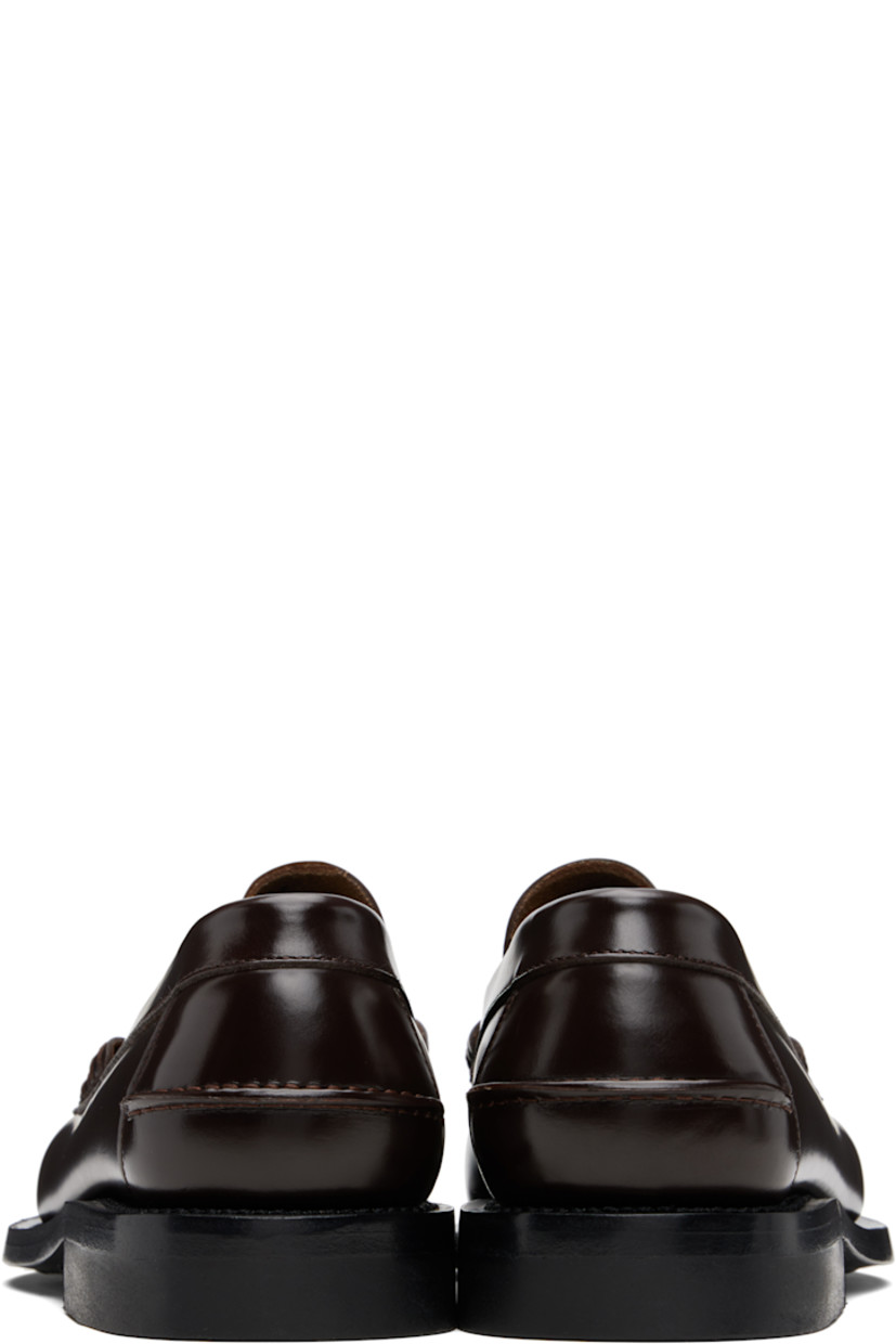 Handcrafted buffed calfskin loafers.

· Moc toe
· Woven detailing at vamp
· Pinched seam at heel counter
· Suede interior
· Stacked calfskin heel
· Calfskin sole

Supplier color: Dark brown