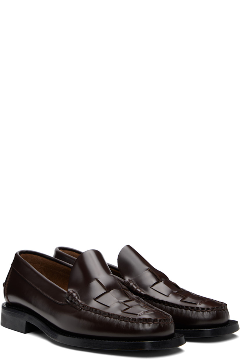 Handcrafted buffed calfskin loafers.

· Moc toe
· Woven detailing at vamp
· Pinched seam at heel counter
· Suede interior
· Stacked calfskin heel
· Calfskin sole

Supplier color: Dark brown