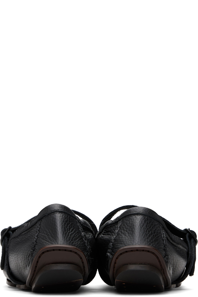 Grained leather loafers.

· Moc toe
· Pin-buckle strap at vamp
· Elasticized collar
· Buffed leather lining
· Leather sole with rubber injection

Supplier color: Black