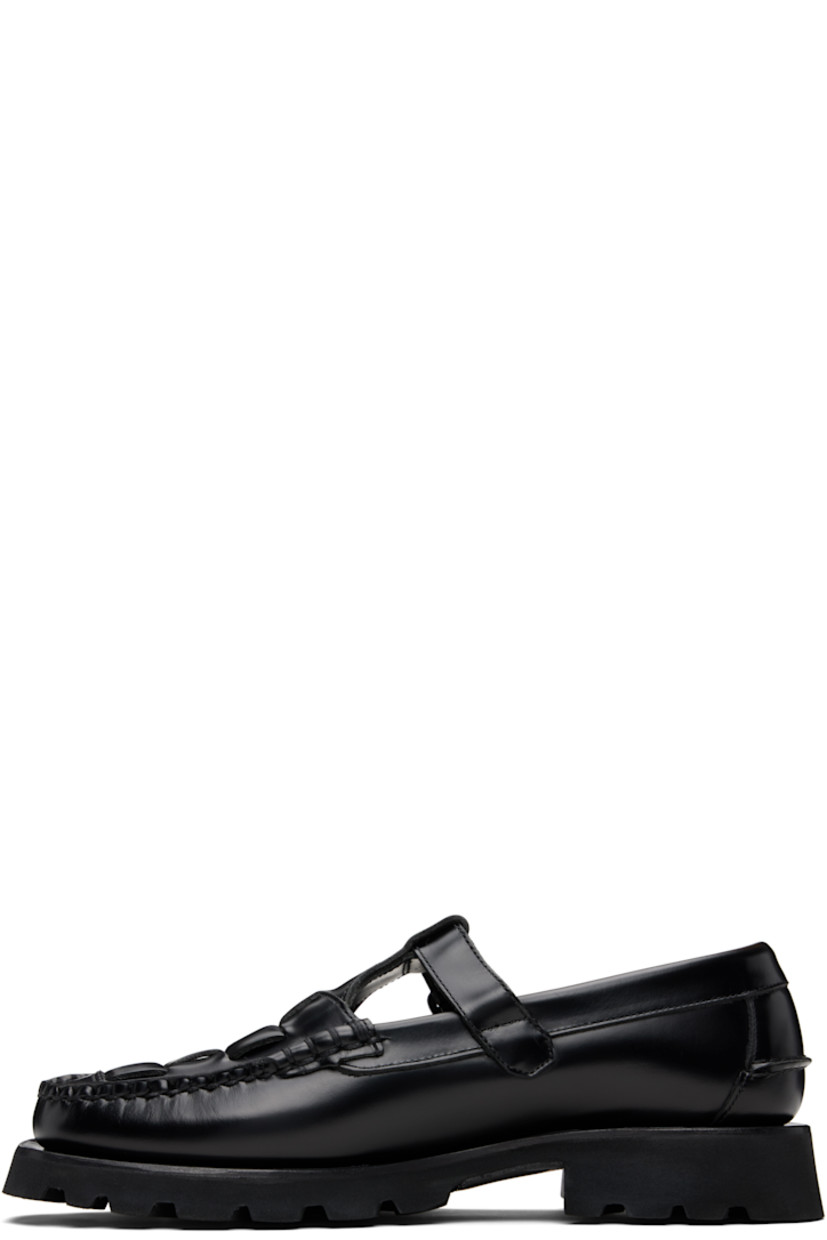 Handcrafted buffed calfskin loafers.

· Moc toe
· Woven detailing at vamp
· Pin-buckle strap
· Pinched seam at heel counter
· Suede interior
· Treaded rubber sole

Supplier color: Black