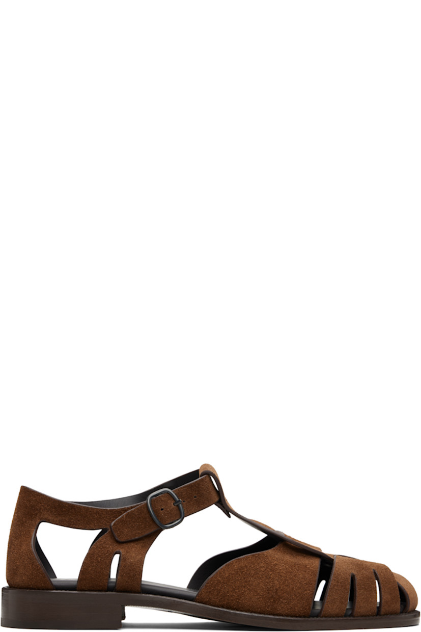 Handcrafted calfskin suede sandals.

· Cutouts throughout
· Woven detailing at vamp
· Pin-buckle ankle strap
· Logo embossed at padded footbed
· Stacked calfskin heel
· Calfskin sole

Supplier color: Tan