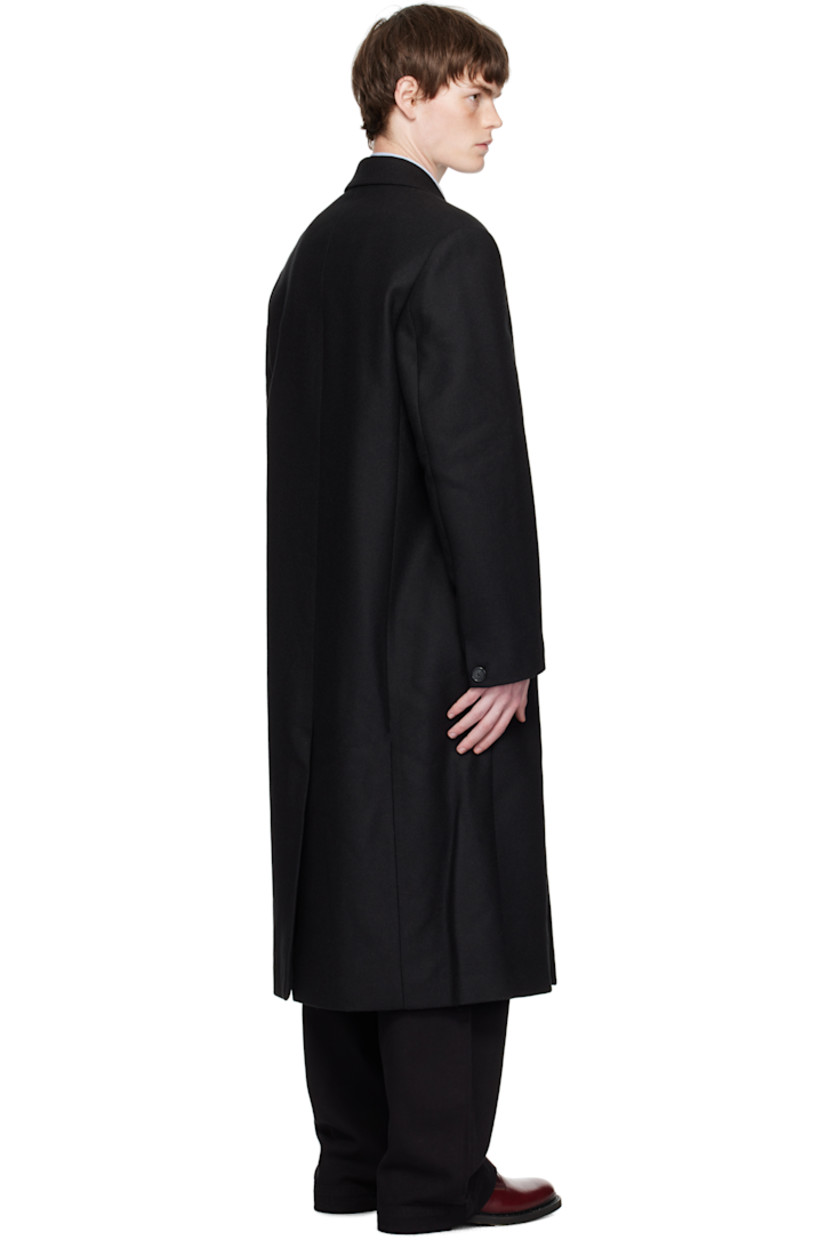 Felted recycled wool-blend twill coat.

· Peaked lapel
· Double-breasted button closure
· Flap pockets at waist
· Padded shoulders
· Button fastening at cuffs
· Central vent at back hem
· Welt pockets at interior
· Full satin lining
· Horn hardware

Supplier color: Black twill
