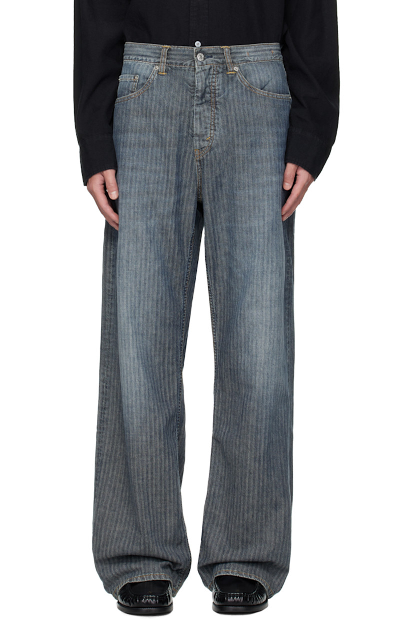 Non-stretch pre-consumer cotton-blend denim jeans. 

· Fading and herringbone pattern throughout 
· Garment-dyed 
· Wide-leg 
· Belt loops
· Five-pocket styling
· Button fly 
· Dropped inseam
· Logo patch at back waistband
· Contrast stitching in tan 

Supplier color: Mid blue herringbone