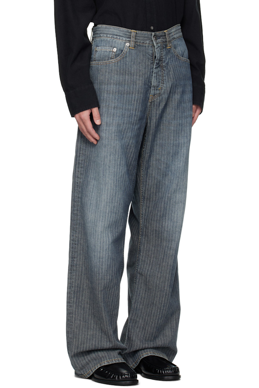 Non-stretch pre-consumer cotton-blend denim jeans. 

· Fading and herringbone pattern throughout 
· Garment-dyed 
· Wide-leg 
· Belt loops
· Five-pocket styling
· Button fly 
· Dropped inseam
· Logo patch at back waistband
· Contrast stitching in tan 

Supplier color: Mid blue herringbone