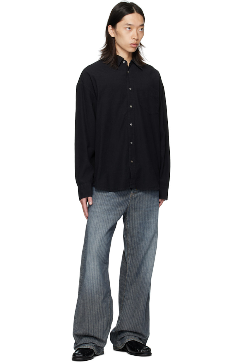Non-stretch pre-consumer cotton-blend denim jeans. 

· Fading and herringbone pattern throughout 
· Garment-dyed 
· Wide-leg 
· Belt loops
· Five-pocket styling
· Button fly 
· Dropped inseam
· Logo patch at back waistband
· Contrast stitching in tan 

Supplier color: Mid blue herringbone