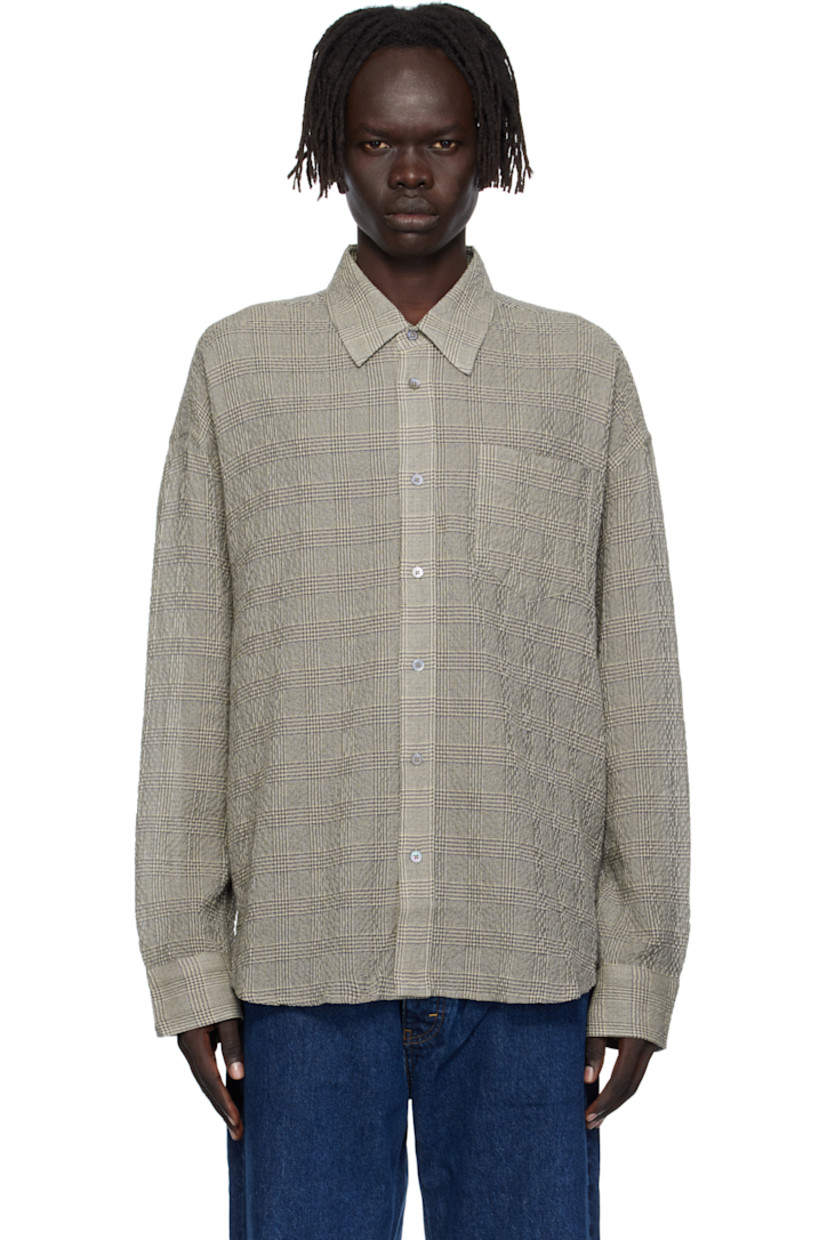 Stretch cotton- and lyocell-blend seersucker shirt.

· Check pattern throughout
· Spread collar
· Button closure
· Patch pocket at chest
· Shirttail hem
· Dropped shoulders
· Adjustable buttoned barrel cuffs
· Box pleat at back yoke
· Mother-of-pearl hardware

Supplier color: Crinkled grey check