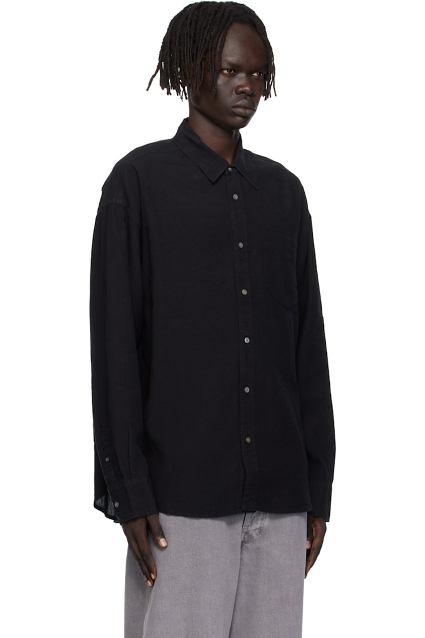Linen- and cotton-blend hopsack shirt.

· Spread collar
· Button closure
· Patch pocket at chest
· Shirttail hem
· Dropped shoulders
· Adjustable buttoned barrel cuffs
· Box pleat at back yoke
· Mother-of-pearl hardware

Supplier color: Tumbled black