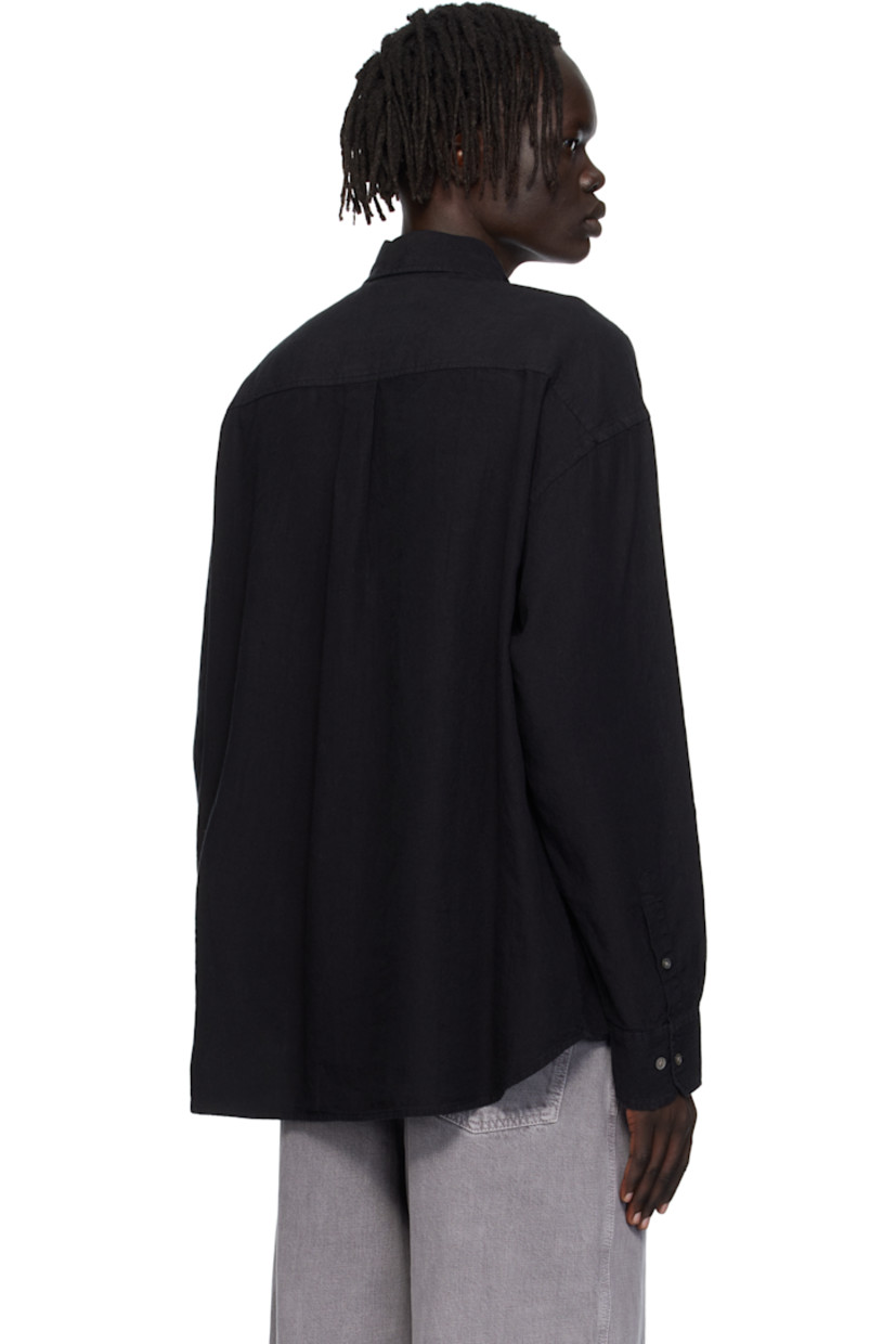 Linen- and cotton-blend hopsack shirt.

· Spread collar
· Button closure
· Patch pocket at chest
· Shirttail hem
· Dropped shoulders
· Adjustable buttoned barrel cuffs
· Box pleat at back yoke
· Mother-of-pearl hardware

Supplier color: Tumbled black