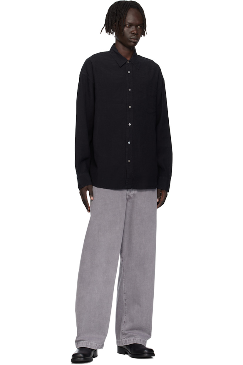 Linen- and cotton-blend hopsack shirt.

· Spread collar
· Button closure
· Patch pocket at chest
· Shirttail hem
· Dropped shoulders
· Adjustable buttoned barrel cuffs
· Box pleat at back yoke
· Mother-of-pearl hardware

Supplier color: Tumbled black