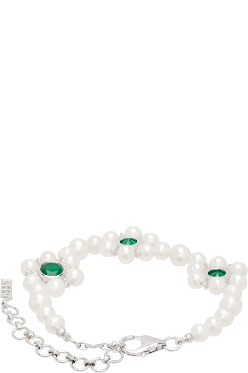 Handcrafted beaded freshwater pearl bracelet. 

· Floral charms with green onyx stones at face
· Logo charm at adjustable lobster-clasp fastening 
· 18k white gold vermeil hardware 
· L9.5"

Supplier color: White gold