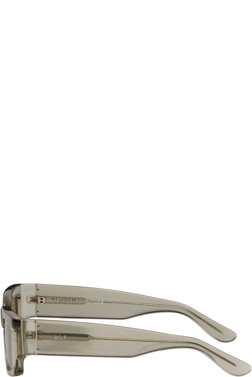 Rectangular transparent acetate-frame sunglasses.

· Gray lenses
· Integrated nose pads
· Logo hardware at temples
· Core wires
· Includes pouch
· Size 55.19 145

Supplier color: Nebbia