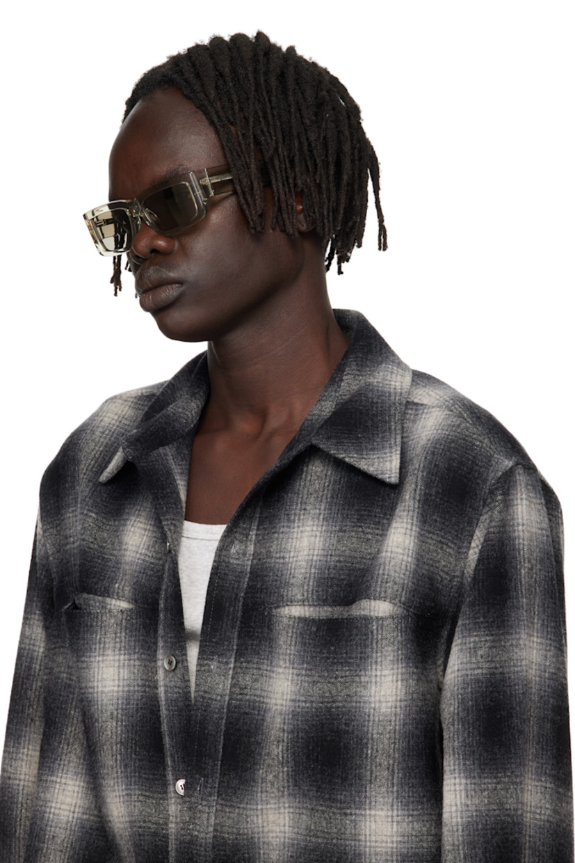 Rectangular transparent acetate-frame sunglasses.

· Gray lenses
· Integrated nose pads
· Logo hardware at temples
· Core wires
· Includes pouch
· Size 55.19 145

Supplier color: Nebbia