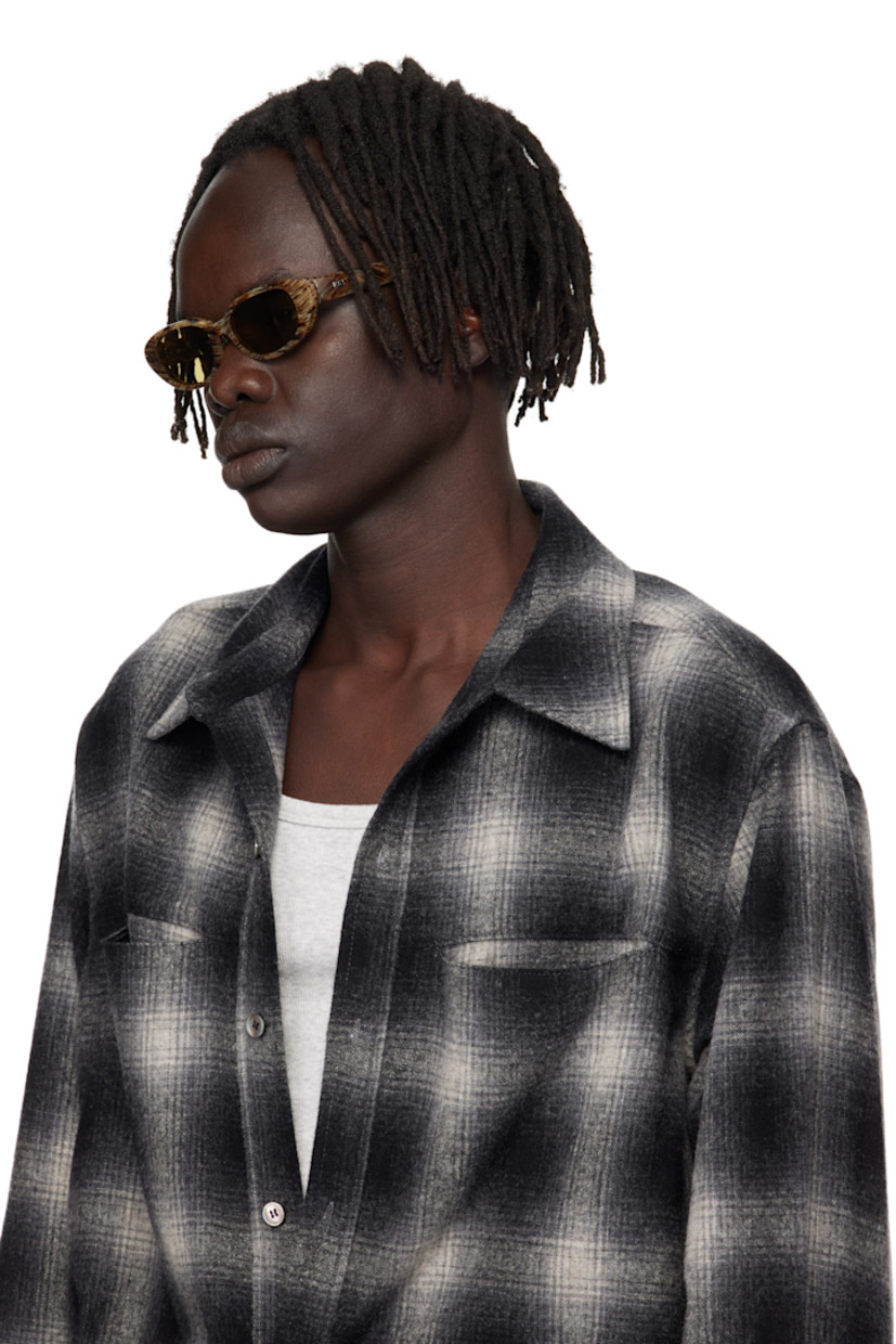 Cat-eye semi-transparent tortoiseshell acetate-frame sunglasses.

· Khaki lenses
· Integrated nose pads
· Logo hardware at temples
· Core wires
· Includes pouch
· Size 51.18 145

Supplier color: Graffiato