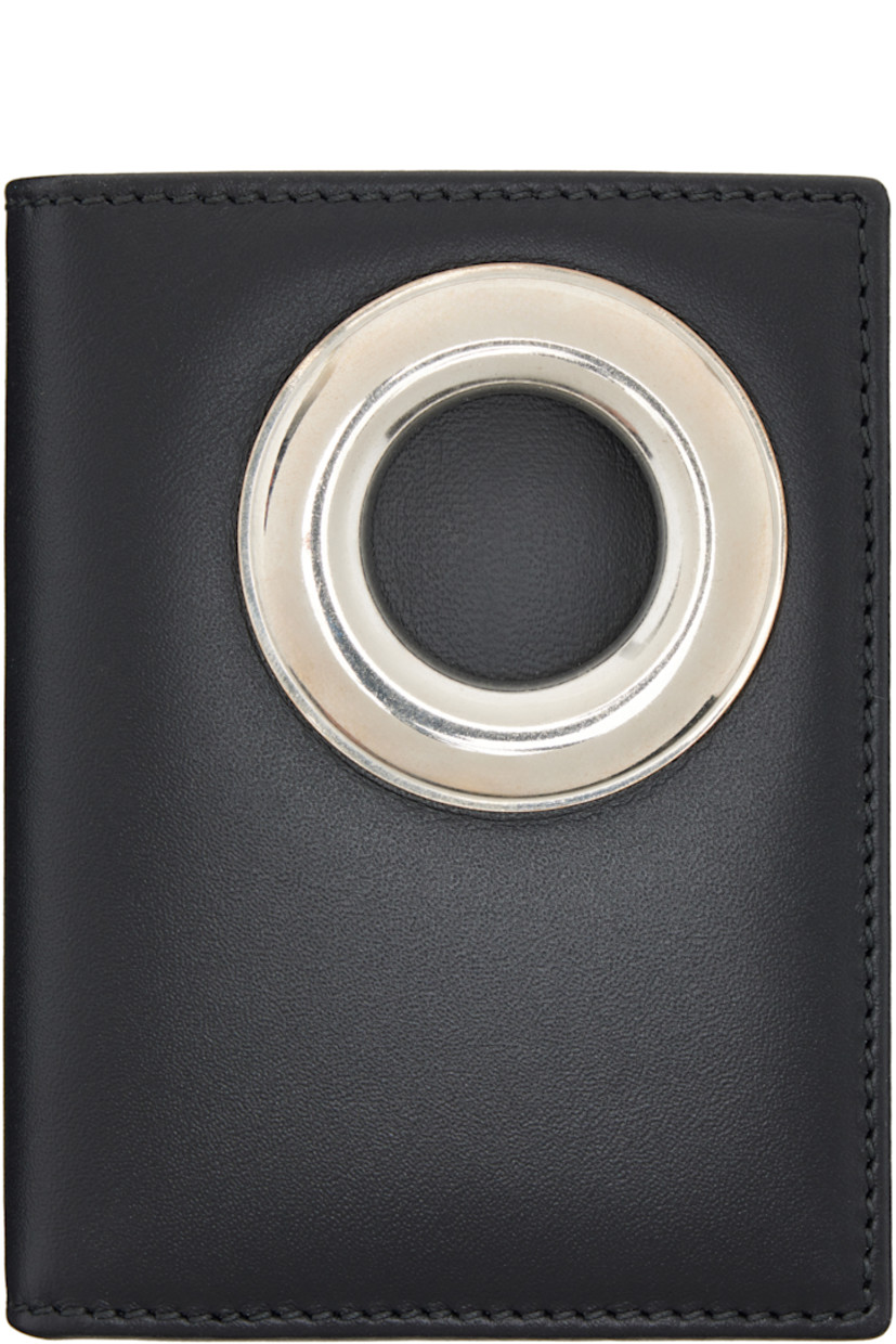 Buffed leather bifold wallet.

· Metal eyelet at face
· Four card slots
· Two patch pockets
· One note slot
· H4" x W3.25" x D1"
 
Supplier color: Black