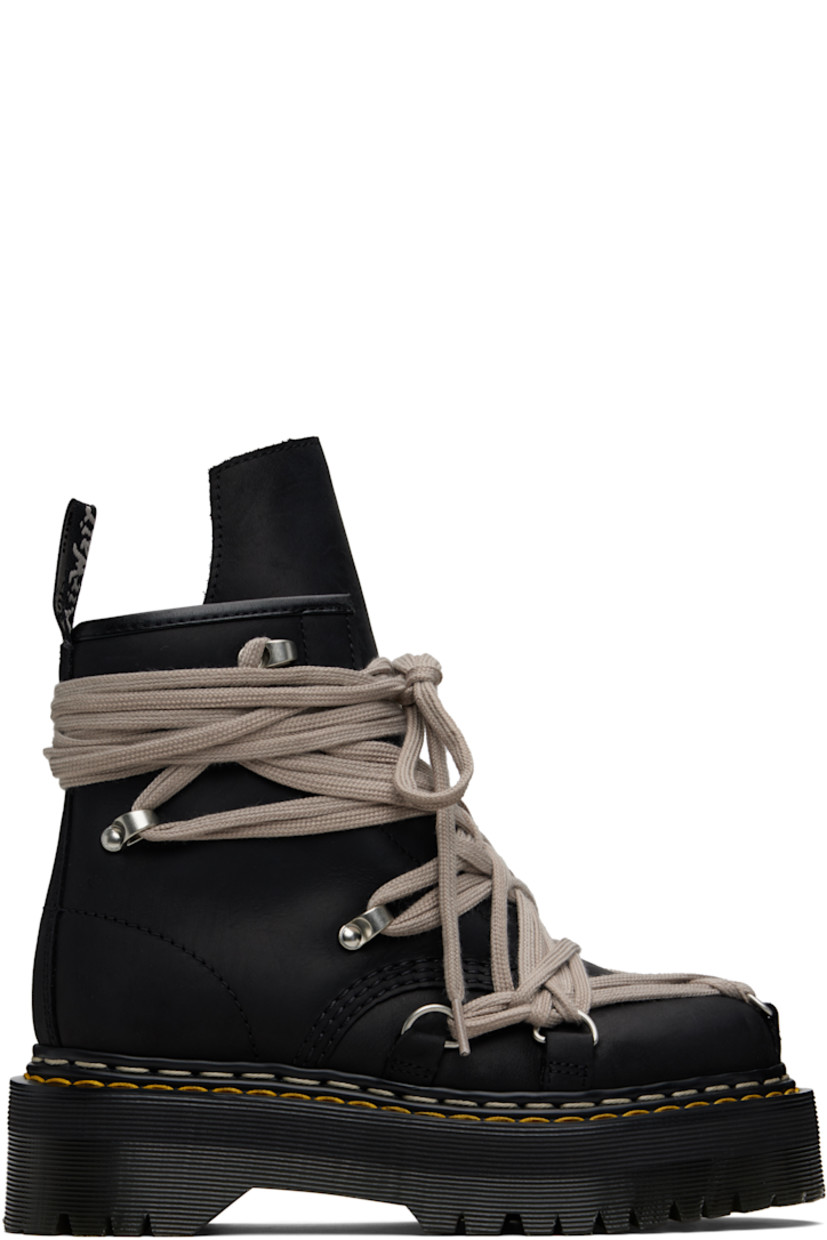 Ankle-high buffed leather boots.

· Wraparound lace-up closure
· Extended tongue
· Zip closure at inner side
· Pull-loop at heel collar
· Yellow stitching at heat-sealed Goodyear welt
· Treaded Air Cushion rubber platform sole
· Platform: H2"

Part of the Rick Owens x Dr. Martens collaboration.

Supplier color: Black
