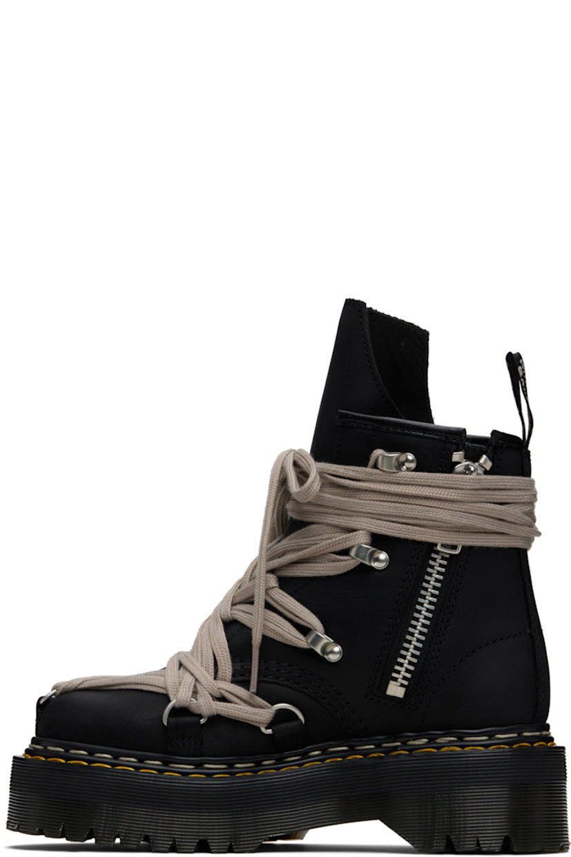 Ankle-high buffed leather boots.

· Wraparound lace-up closure
· Extended tongue
· Zip closure at inner side
· Pull-loop at heel collar
· Yellow stitching at heat-sealed Goodyear welt
· Treaded Air Cushion rubber platform sole
· Platform: H2"

Part of the Rick Owens x Dr. Martens collaboration.

Supplier color: Black