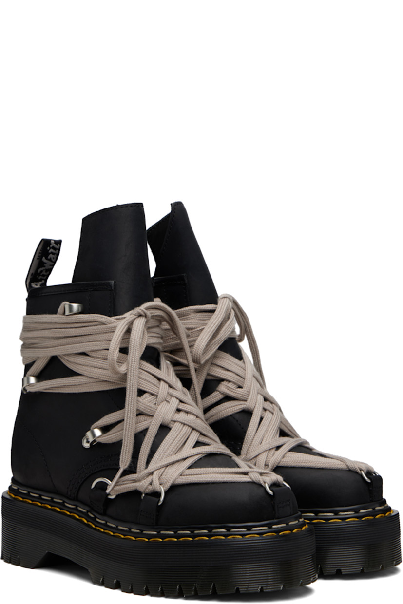 Ankle-high buffed leather boots.

· Wraparound lace-up closure
· Extended tongue
· Zip closure at inner side
· Pull-loop at heel collar
· Yellow stitching at heat-sealed Goodyear welt
· Treaded Air Cushion rubber platform sole
· Platform: H2"

Part of the Rick Owens x Dr. Martens collaboration.

Supplier color: Black