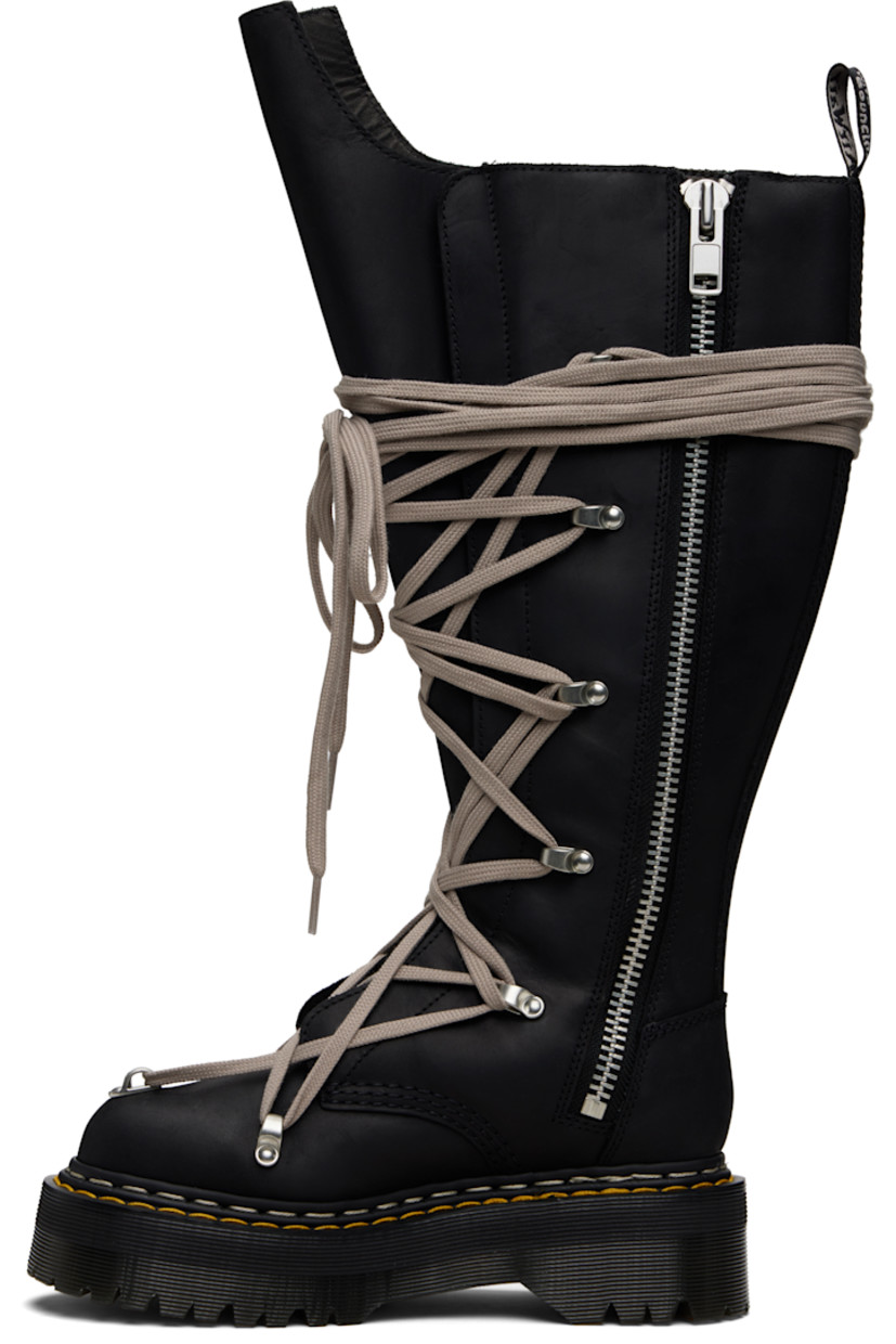 Knee-high buffed leather boots.

· Wraparound lace-up closure
· Extended tongue
· Pull-loop at heel collar
· Zip closure at inner side
· Yellow stitching at heat-sealed Goodyear welt
· Treaded Air Cushion rubber platform sole
· Platform: H2"

Part of the Rick Owens x Dr. Martens collaboration.

Supplier color: Black