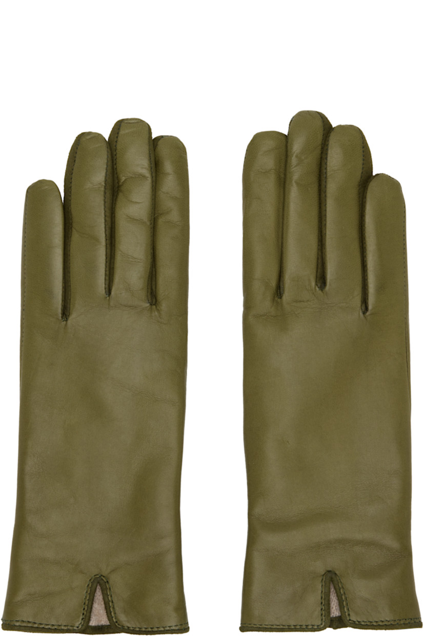 Grained nappa leather gloves.

· Suede trim at fingers
· Partially elasticized wrist
· Notch at top wrist
· Embossed logo at back wrist
· Full knit cashmere-blend lining

Supplier color: Olive