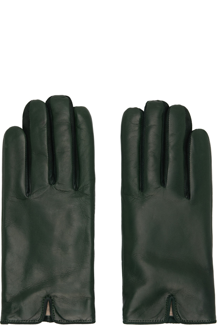 Grained nappa leather gloves.

· Suede trim at fingers
· Partially elasticized wrist
· Notch at top wrist
· Embossed logo at back wrist
· Full knit cashmere-blend lining

Available exclusively at SSENSE.

Supplier color: Agave