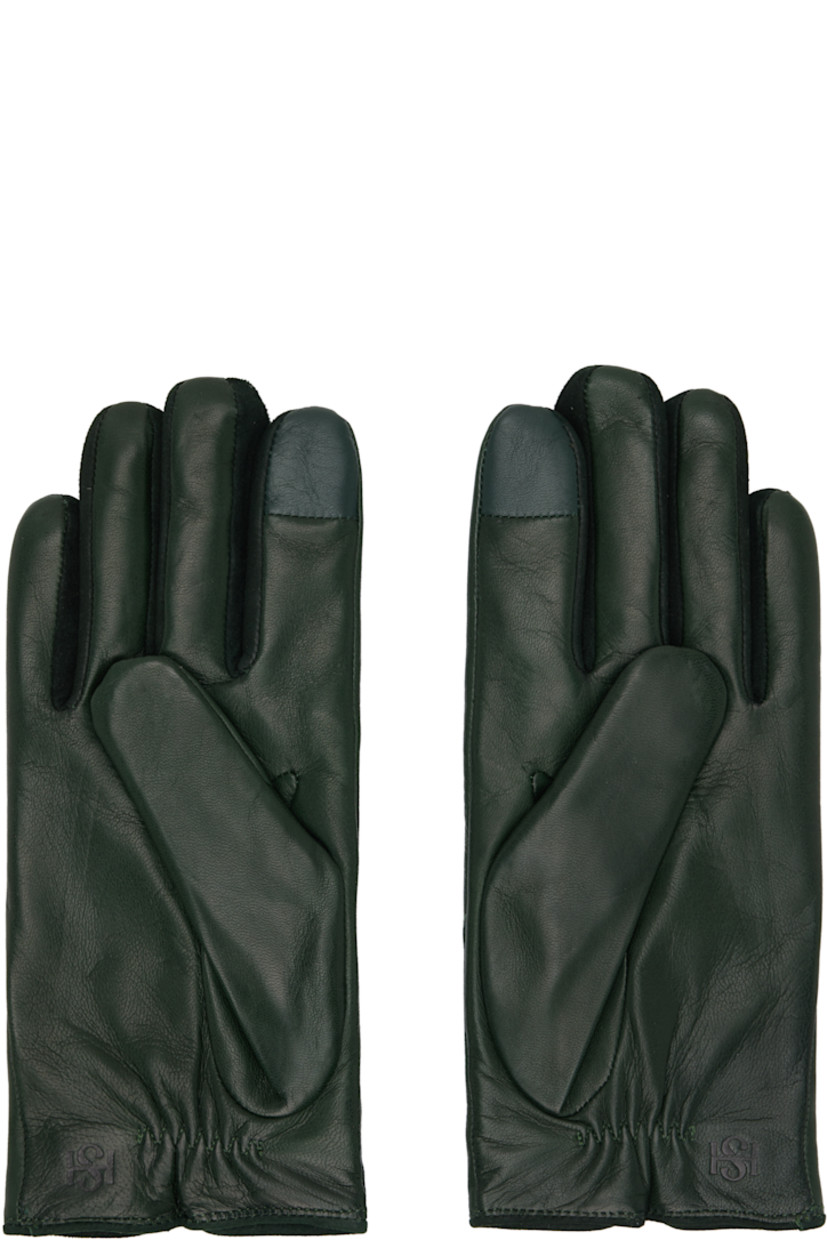 Grained nappa leather gloves.

· Suede trim at fingers
· Partially elasticized wrist
· Notch at top wrist
· Embossed logo at back wrist
· Full knit cashmere-blend lining

Available exclusively at SSENSE.

Supplier color: Agave