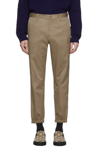 Gucci: Khaki Stripe Trousers | SSENSE