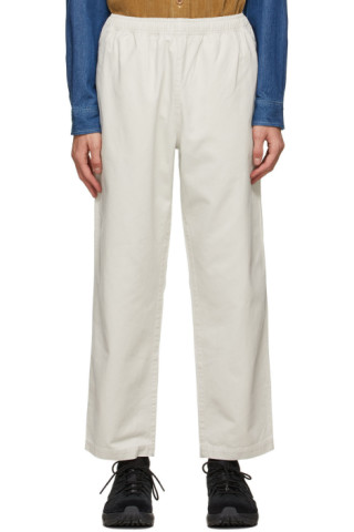 Stüssy: Off-White Brushed Beach Trousers | SSENSE