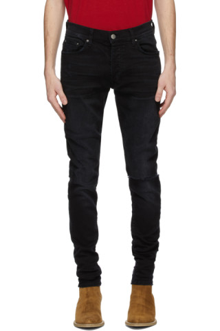 Black Slit Knee Jeans by AMIRI on Sale