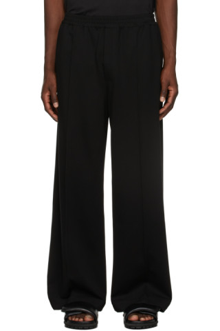 Black Flared Trousers by Situationist on Sale