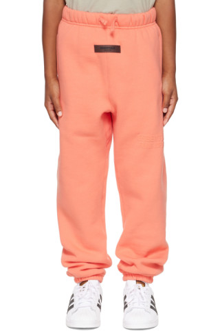 Kids Pink Logo Lounge Pants by Fear of God ESSENTIALS on Sale