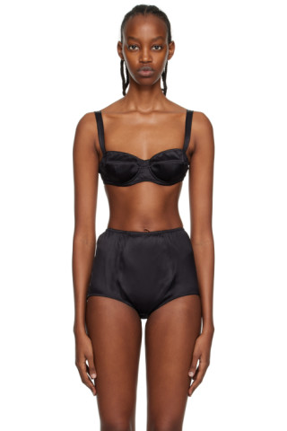 The Caron harness bra in black satin with strap detailing.