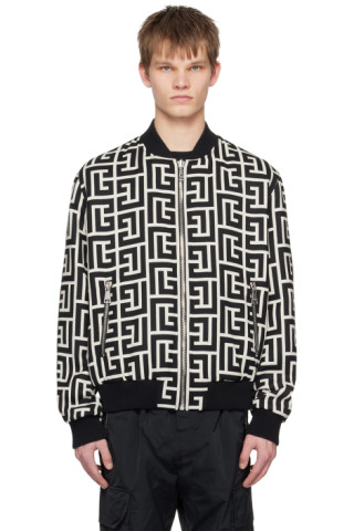 Balmain: Black Monogram Reversible Bomber Jacket | SSENSE