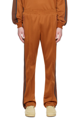 Orange Narrow Track Pants by NEEDLES on Sale Orange Narrow Track Pants by NEEDLES on Sale