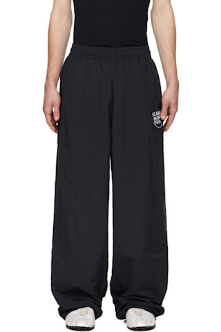VETEMENTS: Black 'Global MF' Track Pants | SSENSE