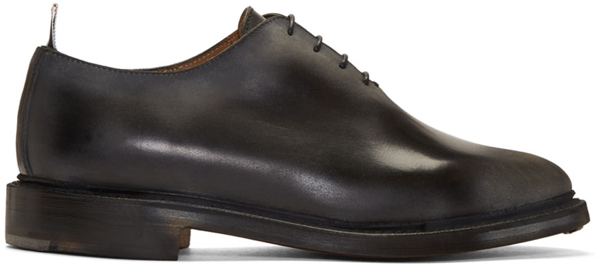 Thom Browne: Black Wholecut Distressed Oxfords | SSENSE