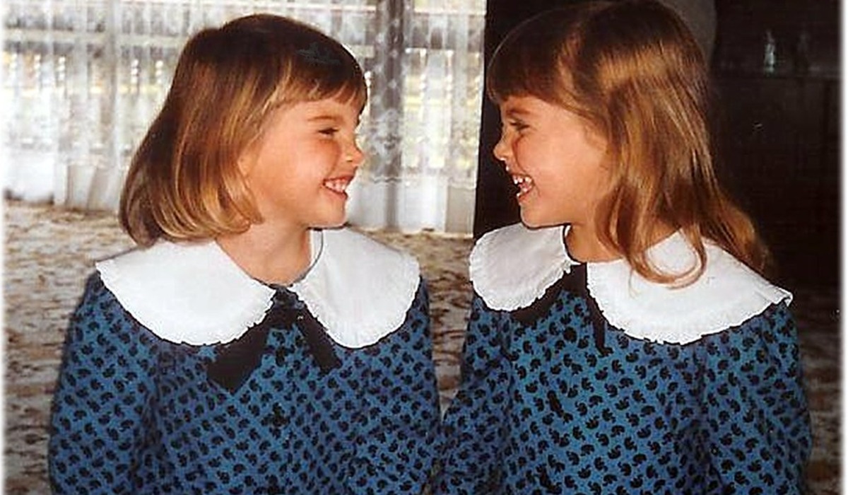 a couple of girls posing for the camera