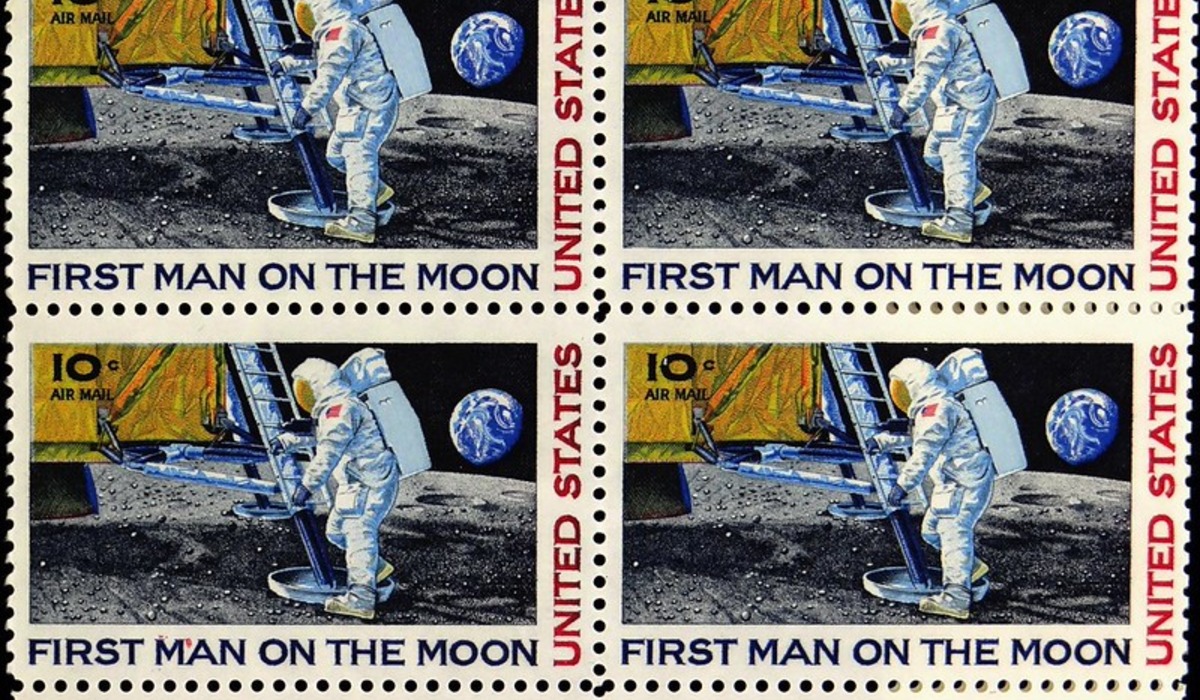 Buzz Aldrin on the moon in front of the US flag