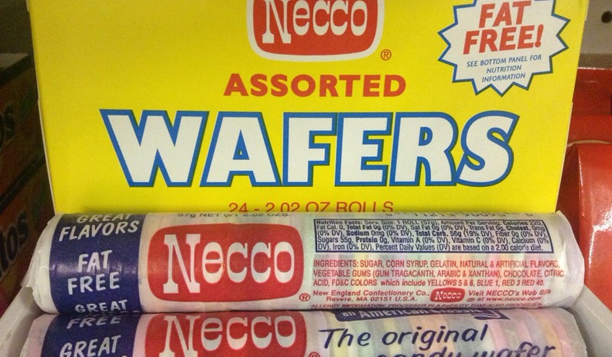 Candy bars displayed in a vending machine slots