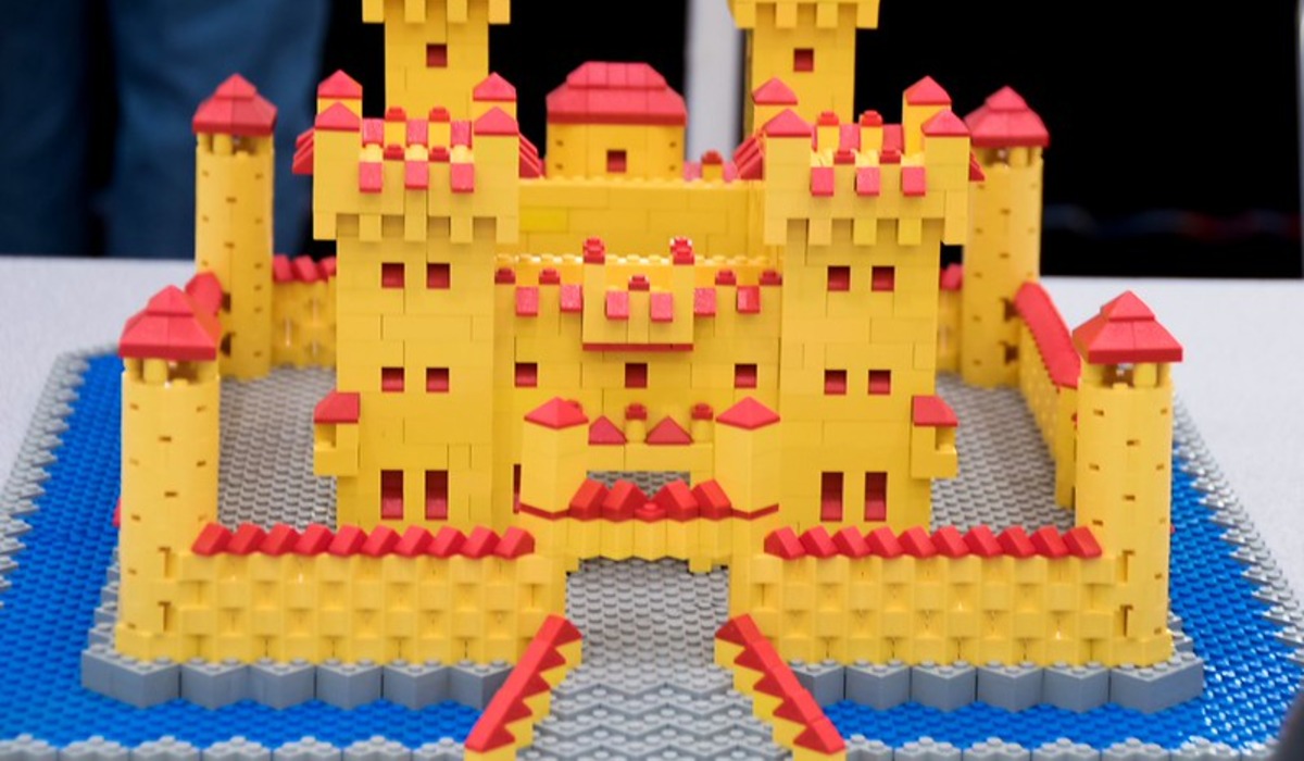 a castle with a yellow strip on the side of it